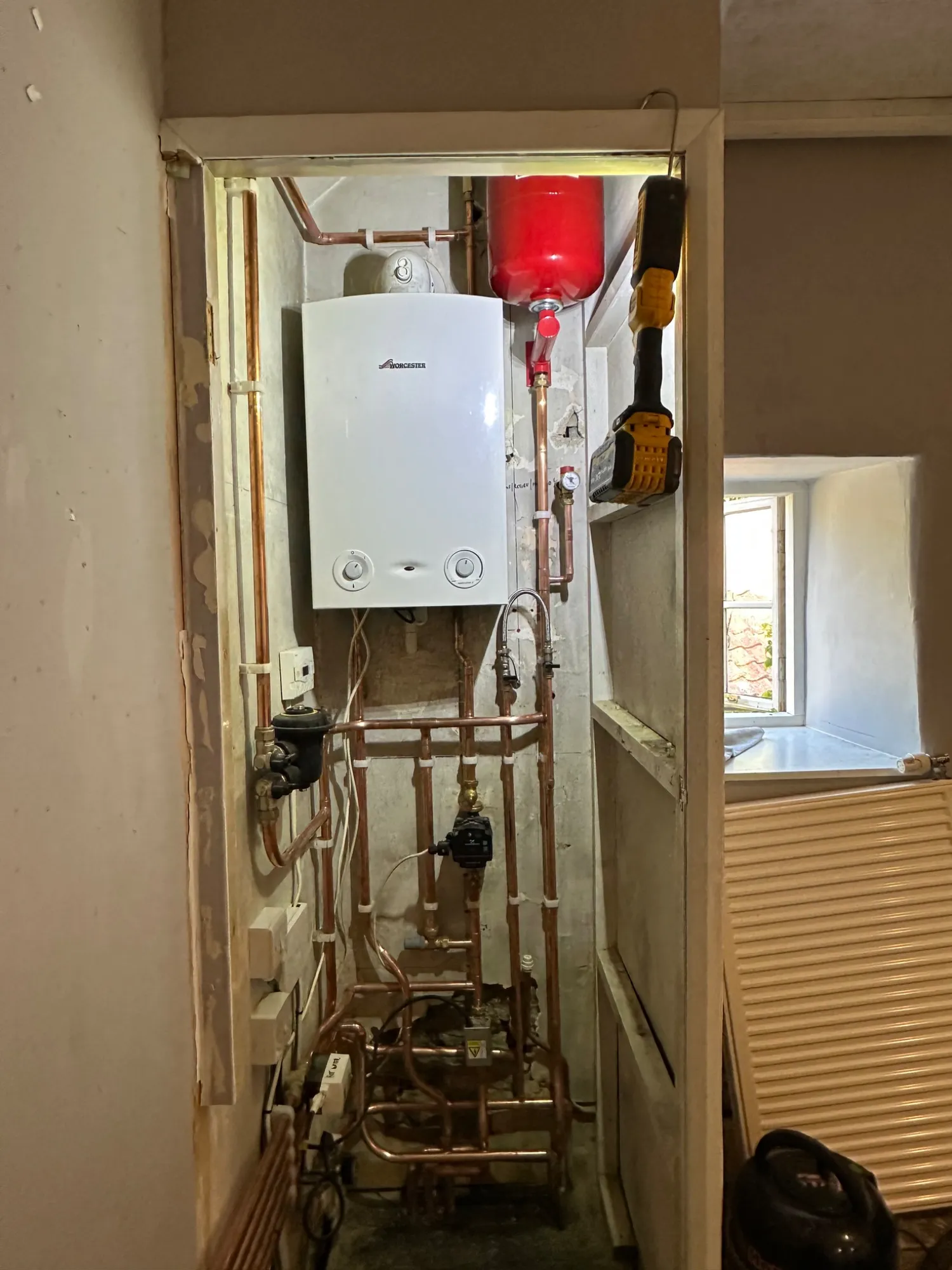 New Worcester heat-only boiler and copper pipework installed in a cupboard in Bath